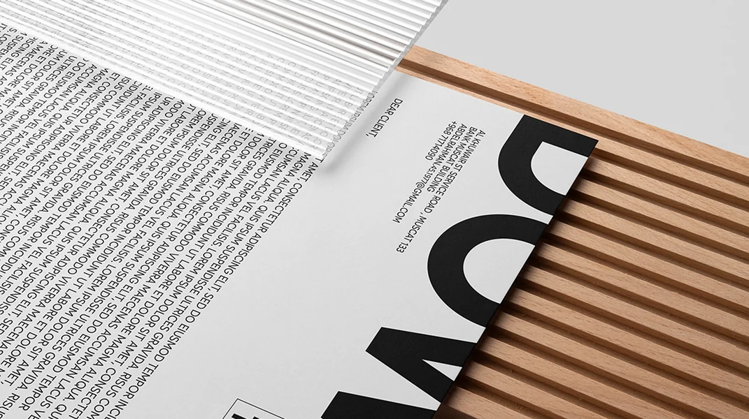 Downtown Group print collateral on a wooden slat surface
