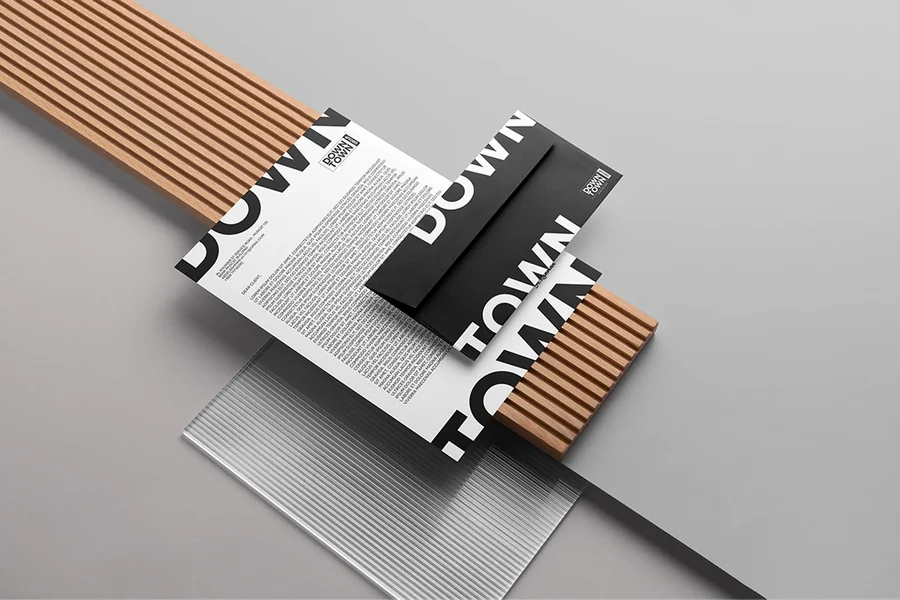 Downtown Group stationery set laid out on a wooden surface