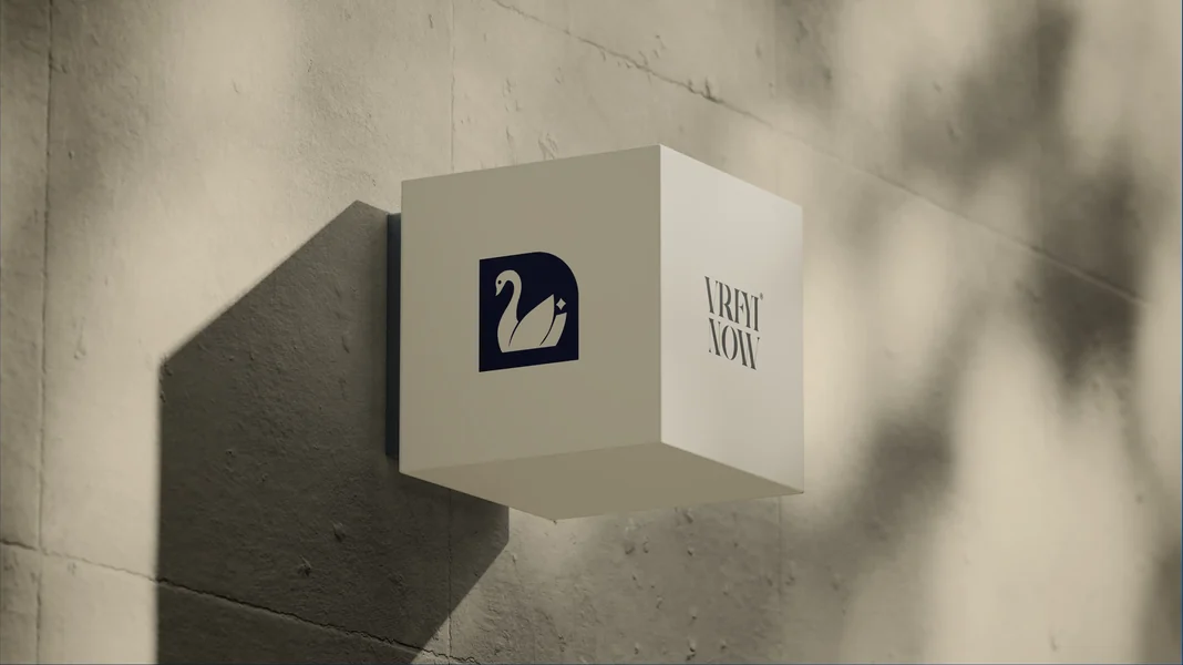 Vryfi Now logo on a folded card against a concrete wall